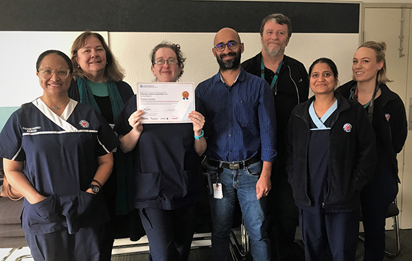 Employee of Djeran, Elaine (third from right) with Maggiie O'Dea (second from left), Manager Eldhose Baby (fourth from left) and coworkers.