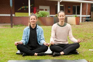 Two women meditating