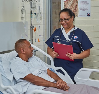 Aboriginal nurse with patient